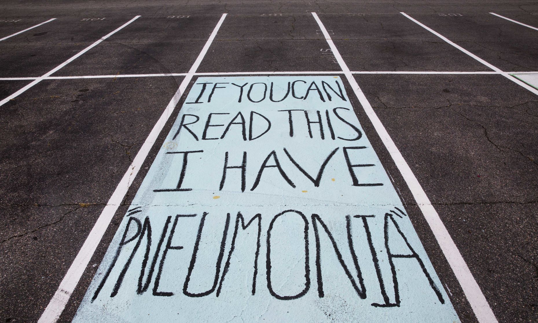 Students painting their parking spaces